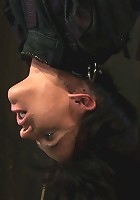 Bound in a straightjacket, inverted suspendedFucked by a machine, made to suck cock & zippered.