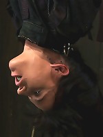 Bound in a straightjacket, inverted suspendedFucked by a machine, made to suck cock & zippered.