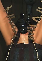 Bound in a straightjacket, inverted suspendedFucked by a machine, made to suck cock & zippered.