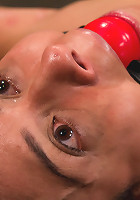 Bound by metal, covered in wax, fucked by machine