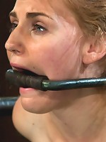 Bound in a custom metal bondage rig. Made to cum, she can't stop the orgasms that rip though her