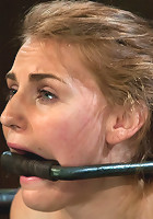 Bound in a custom metal bondage rig. Made to cum, she can't stop the orgasms that rip though her