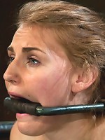 Bound in a custom metal bondage rig. Made to cum, she can't stop the orgasms that rip though her