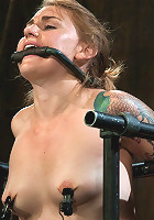 Bound in a custom metal bondage rig. Made to cum, she can't stop the orgasms that rip though her