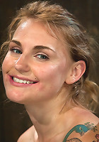 Bound in a custom metal bondage rig. Made to cum, she can't stop the orgasms that rip though her