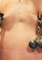 Tiny sexy blond suffers heavy weighted nipple clamps & a crotch burner that keeps her on her toes!