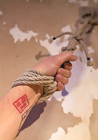 Tall hot blonde on tip-toes hanging from a crotch rope, made to squirt.