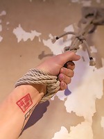 Tall hot blonde on tip-toes hanging from a crotch rope, made to squirt.