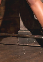 Skin is bound to a beam and a back breaker arches her to the limitFlogged and made to come!