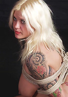 Tattooed blonde getting bound
