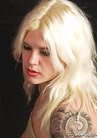 Tattooed blonde getting bound