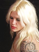 Tattooed blonde getting bound