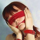 Beautiful girl in red rubber skirt and black corsette