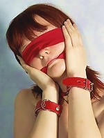 Beautiful girl in red rubber skirt and black corsette