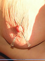 Mature slave gets needles on her nipples