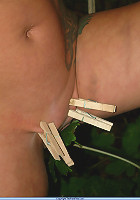 Slavegirl with clothespins on her tits is bound outside to a tree