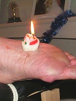 Woman gets hot candle wax on her bare foot