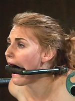 Bound in a custom metal bondage rig. Made to cum, she can't stop the orgasms that rip though her