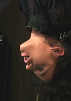 Bound in a straightjacket, inverted suspendedFucked by a machine, made to suck cock & zippered.