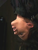 Bound in a straightjacket, inverted suspendedFucked by a machine, made to suck cock & zippered.