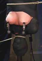 Cute little blond girl is mummified, vibrator stuck on her clit. Hung upside down to cum & cum.