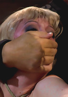 Blond with killer natural body, is suspended, suffers intense foot caningMade to cum over & over